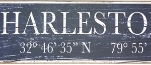 Charleston, SC sign with coordinates displayed.